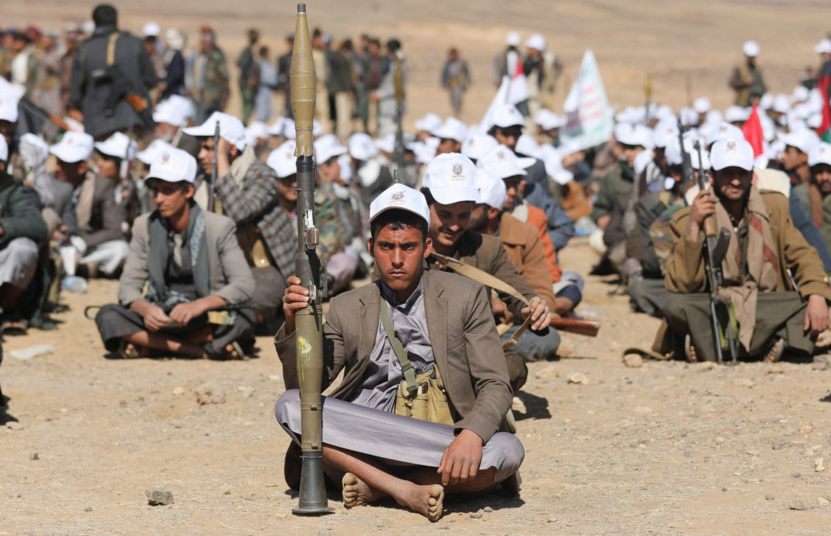 Houthi sitting during a military parade