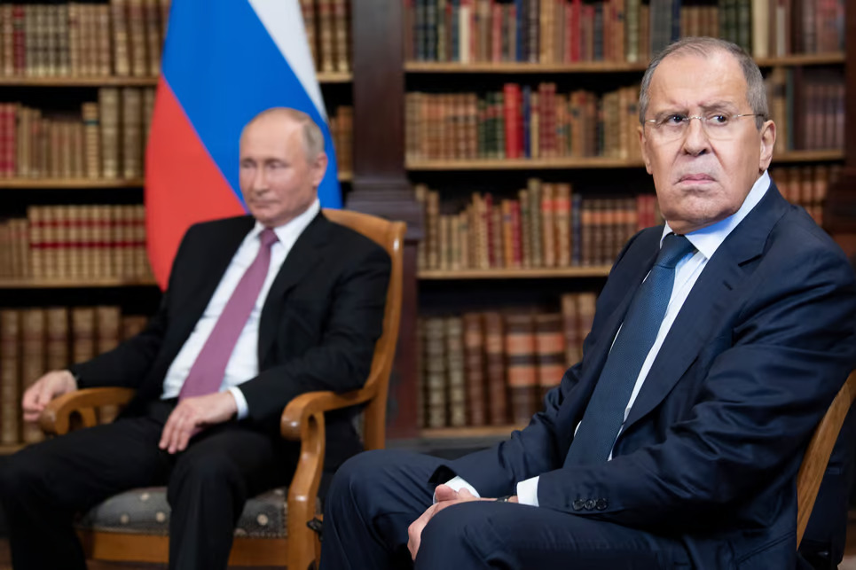 Russian Foreign Minister Sergei Lavrov looks and Russian President Vladimir Putin | Brendan Smialowski/AFP via Getty Images